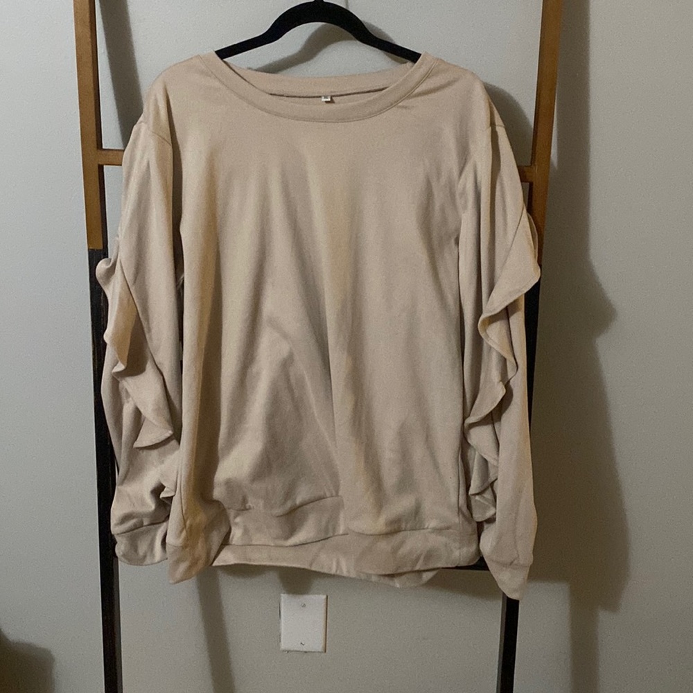 Ruffle sleeve sweatshirt.